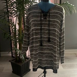 Plus Size Black & White striped sweater with lace up on front.